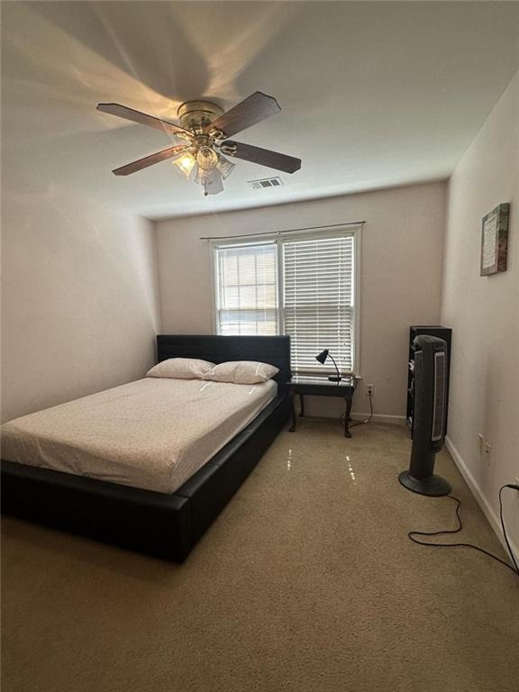 239 Sweet Cane Trail Grayson, GA 30017 - Photo 25 of 30 a bed room with a bed and window