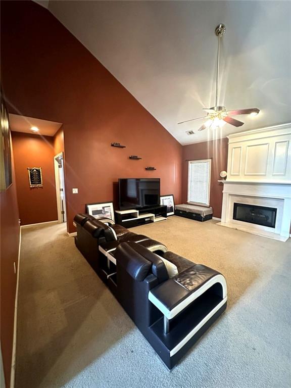 239 Sweet Cane Trail Grayson, GA 30017 - Photo 28 of 30 a living room with furniture flat screen tv and a fireplace