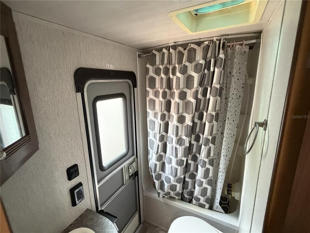 3000 Clarcona Road, Unit 743 Apopka, FL 32703 - Photo 46 of 54 a bathroom with a toilet and a mirror