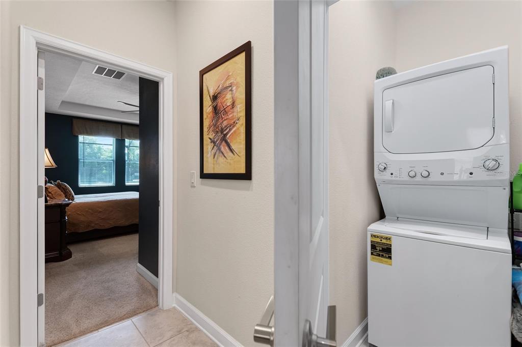 1089 Blackwolf Run Road Davenport, FL 33896 - Photo 12 of 82 a utility room with dryer and washer