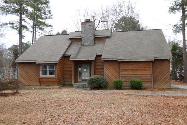 140 Timber Ridge Drive Macon, GA 31216 - Photo 1 of 15 a view of a house with a yard and garage