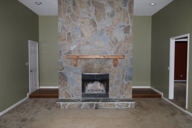 140 Timber Ridge Drive Macon, GA 31216 - Photo 2 of 15 a living room with a fireplace
