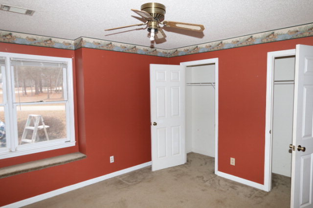 140 Timber Ridge Drive Macon, GA 31216 - Photo 5 of 15 a view of a room with a chandelier fan and windows