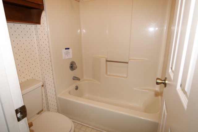 140 Timber Ridge Drive Macon, GA 31216 - Photo 7 of 15 a white bath tub sitting next to a white toilet