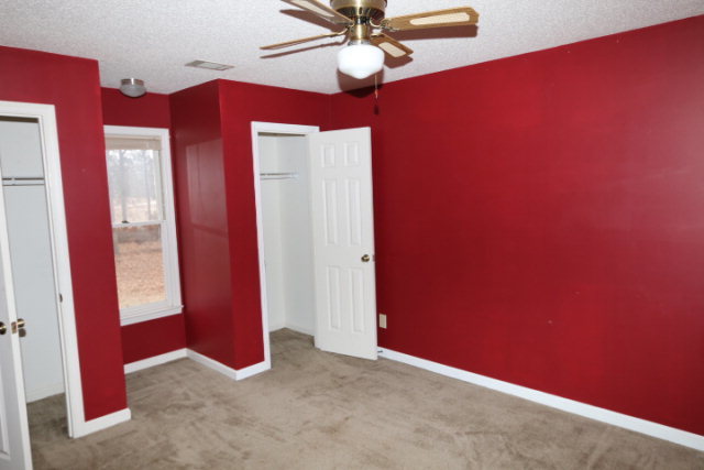 140 Timber Ridge Drive Macon, GA 31216 - Photo 8 of 15 a view of an empty room with a chandelier fan