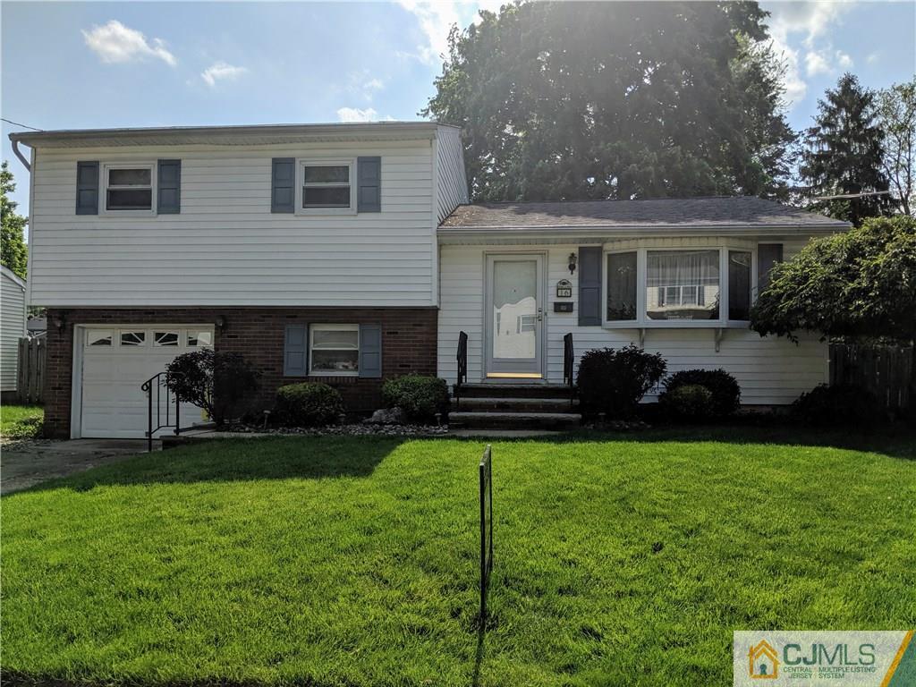 16 Baldwin Road Edison, NJ 08817 - Photo 1 of 12 a front view of house with yard and outdoor seating