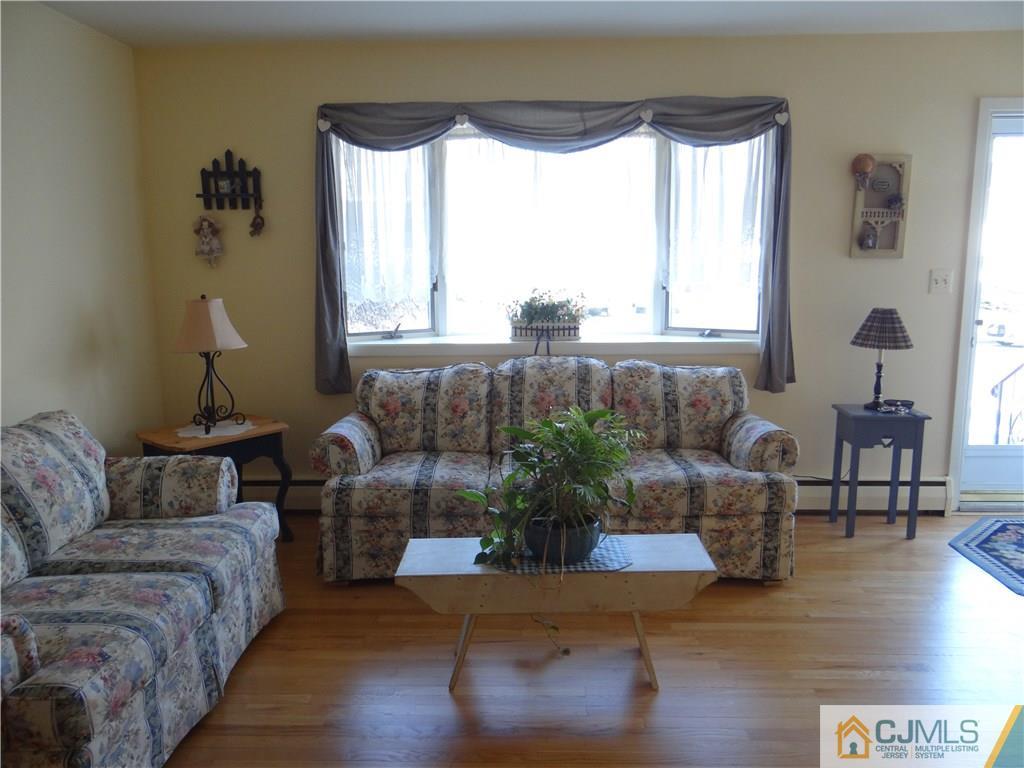 16 Baldwin Road Edison, NJ 08817 - Photo 2 of 12 a living room with furniture and a large window