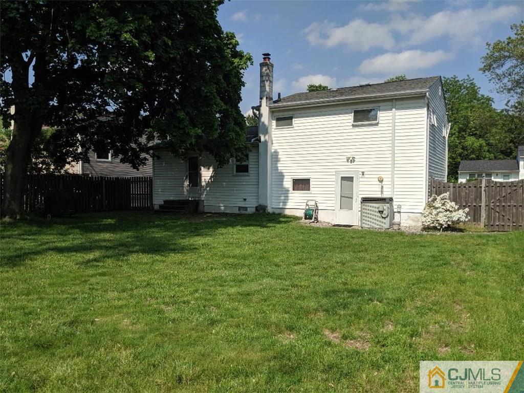 16 Baldwin Road Edison, NJ 08817 - Photo 12 of 12 a view of backyard of house with green space