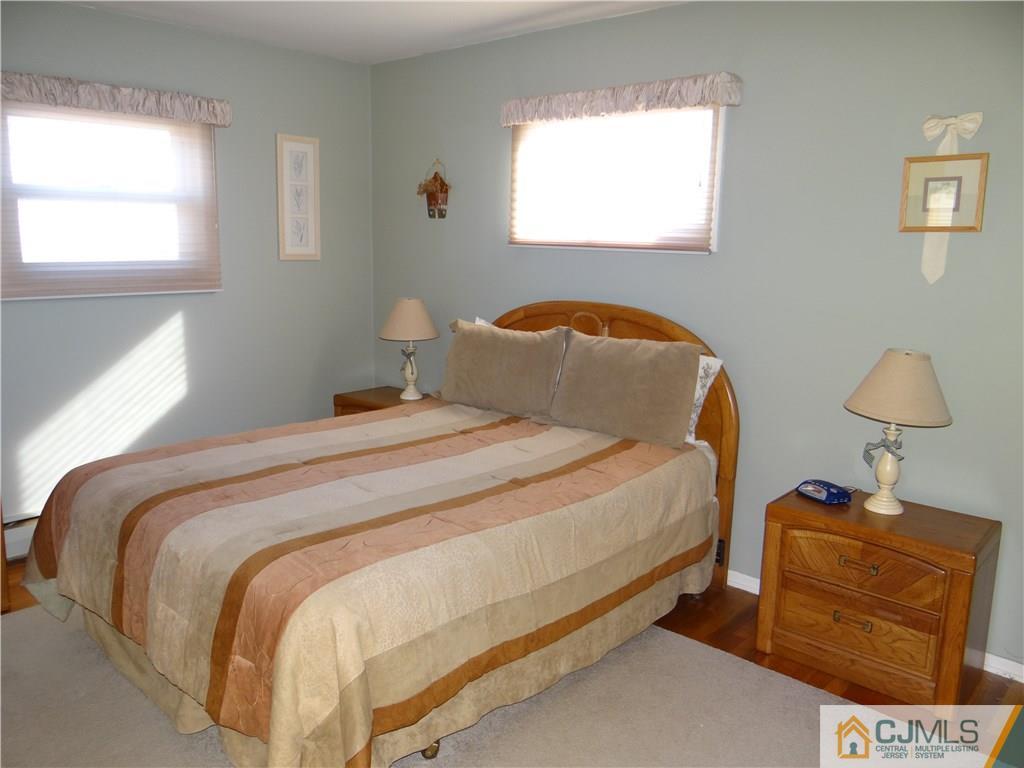 16 Baldwin Road Edison, NJ 08817 - Photo 7 of 12 a bedroom with a bed and a window
