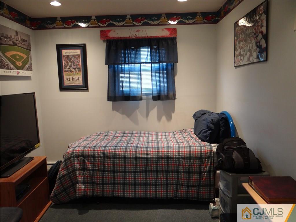 16 Baldwin Road Edison, NJ 08817 - Photo 9 of 12 a bedroom with a bed and window