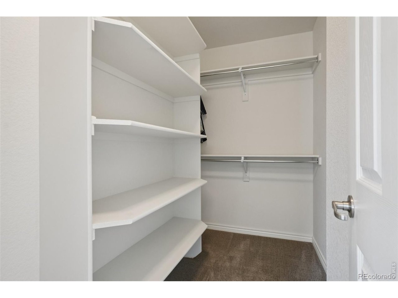 727 Rawlins Way Lafayette, CO 80026 - Photo 18 of 27 Primary bedroom walk-in closet