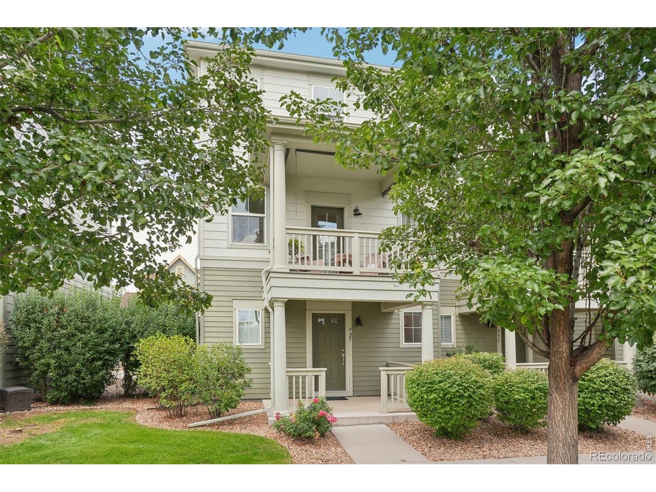 727 Rawlins Way Lafayette, CO 80026 - Photo 2 of 27 Front of home with Lower covered entry and main level covered balcony.