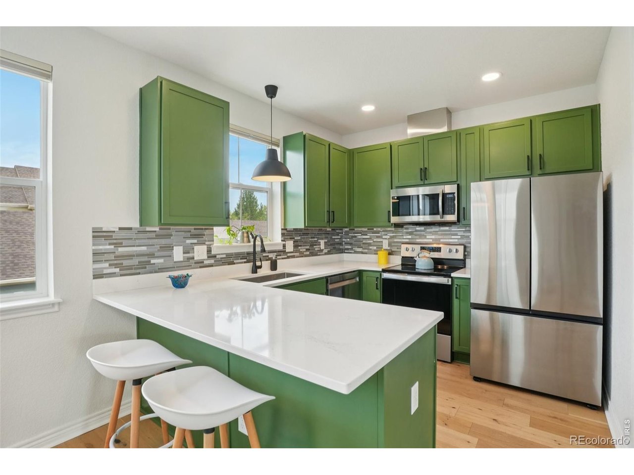 727 Rawlins Way Lafayette, CO 80026 - Photo 9 of 27 Kitchen with newer appliances and upgraded lighting!