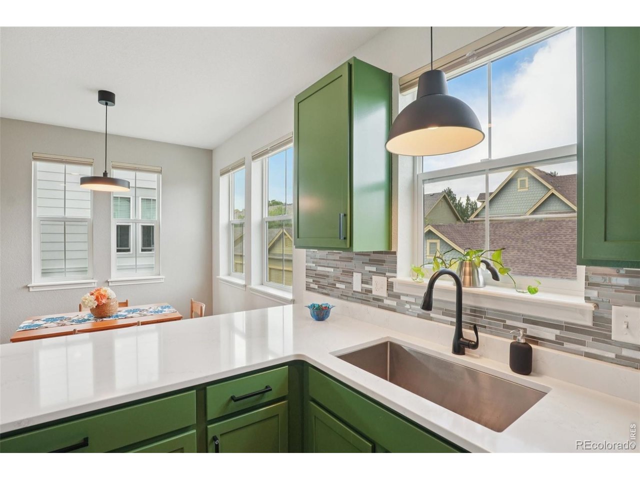 727 Rawlins Way Lafayette, CO 80026 - Photo 10 of 27 Kitchen with farm sink and upgraded lighting