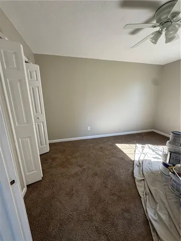 an empty room with closet area