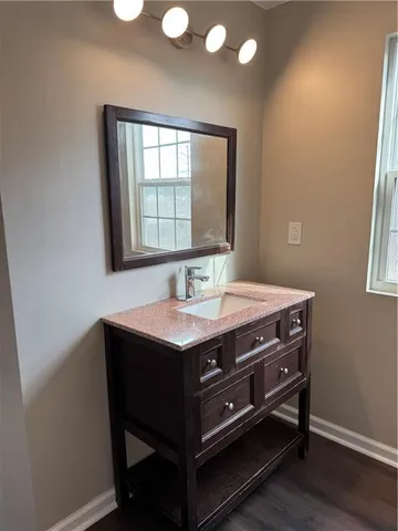 a bathroom with a bathtub shower sink and toilet