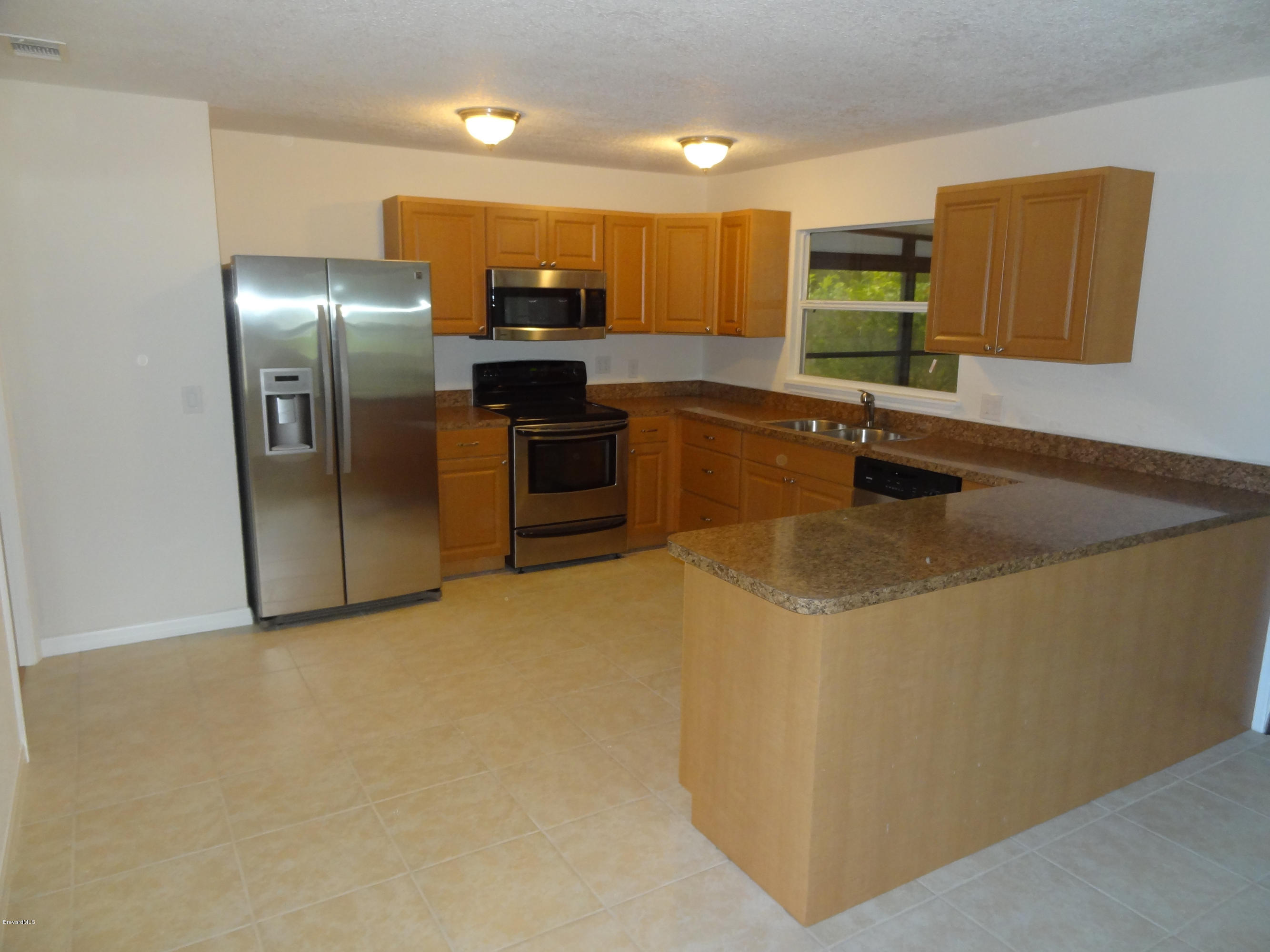 1107 Cromey Road Northeast Palm Bay, FL 32905 - Photo 3 of 14 Kitchen