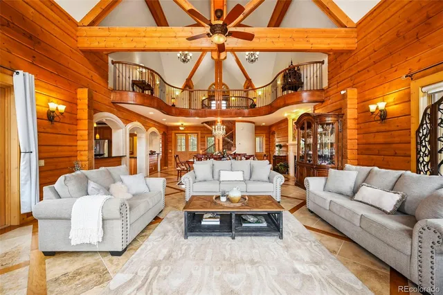 a view of a brick building with couches chairs and a potted plant