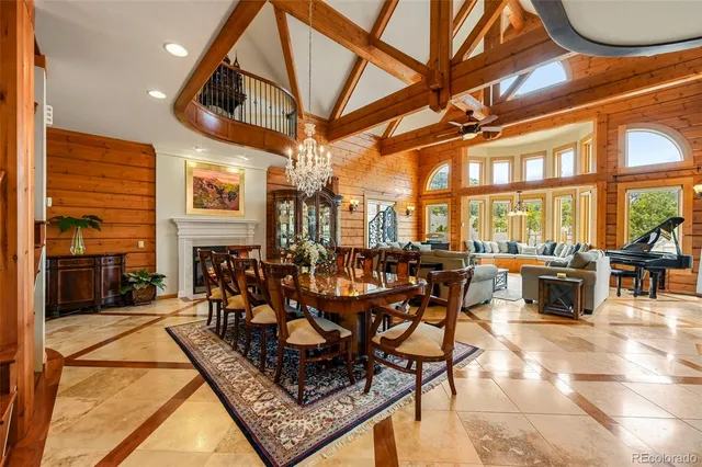 a bedroom with a large bed and large windows
