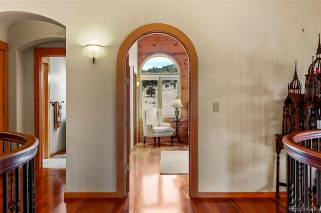 a living room with furniture rug and window