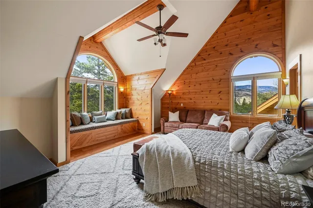 a living room with furniture a lamp and a window