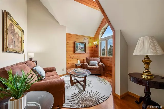 a living room with fireplace furniture and a fireplace