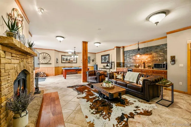 a living room with furniture a window and a flat screen tv
