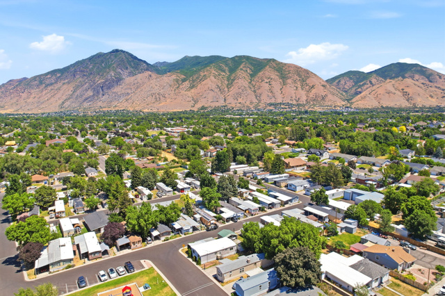 1525 South 400 East, Unit 13 Springville, UT 84663 - Photo 30 of 32 Aerial perspective showcasing a residential community with mature trees and a distant mountain backdrop