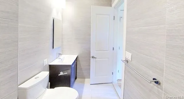 a bathroom with a toilet a sink and shower