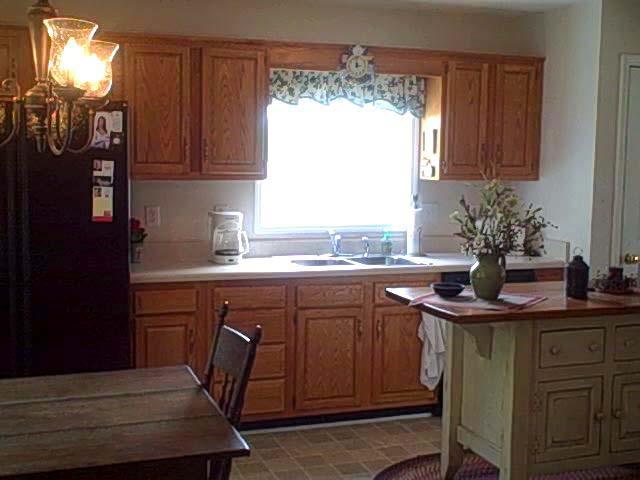 1770 Meadows Road Vinton, VA 24179 - Photo 14 of 37 a kitchen with sink cabinets and window