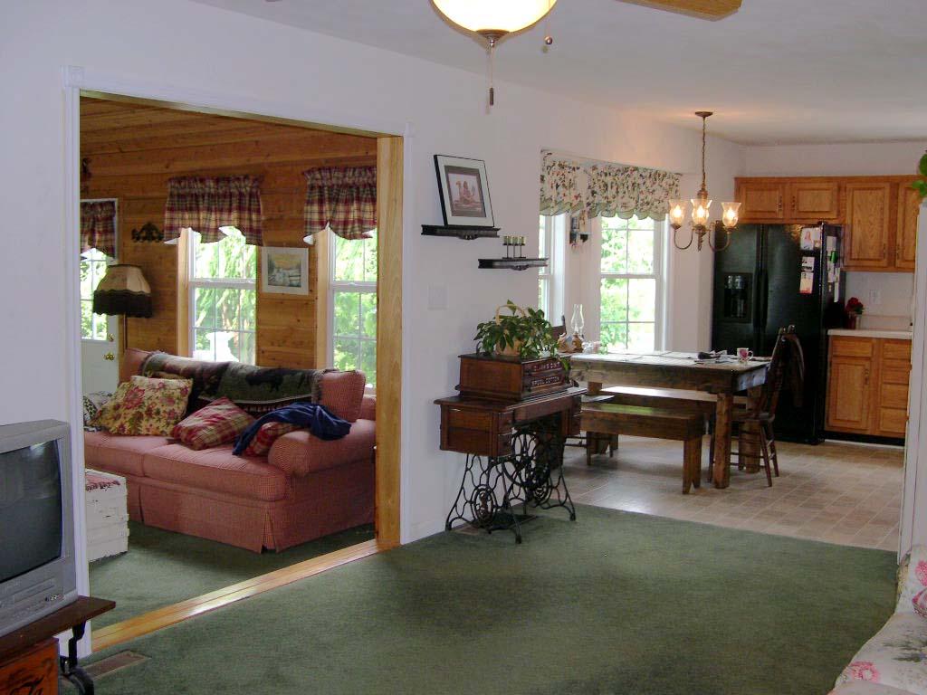 1770 Meadows Road Vinton, VA 24179 - Photo 29 of 37 a living room with furniture and a chandelier
