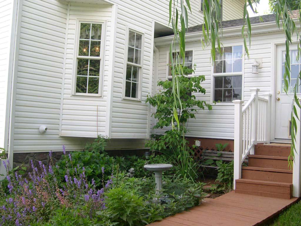 1770 Meadows Road Vinton, VA 24179 - Photo 33 of 37 a view of a house with wooden door and potted plants