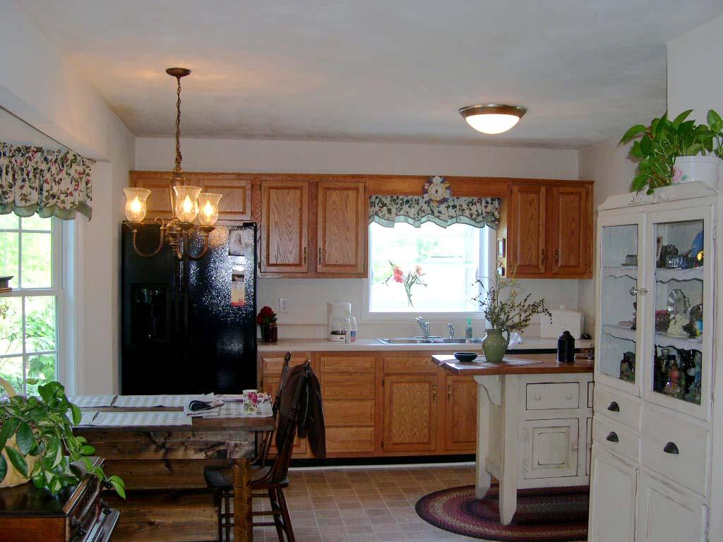 1770 Meadows Road Vinton, VA 24179 - Photo 37 of 37 a kitchen with granite countertop white cabinets and black appliances
