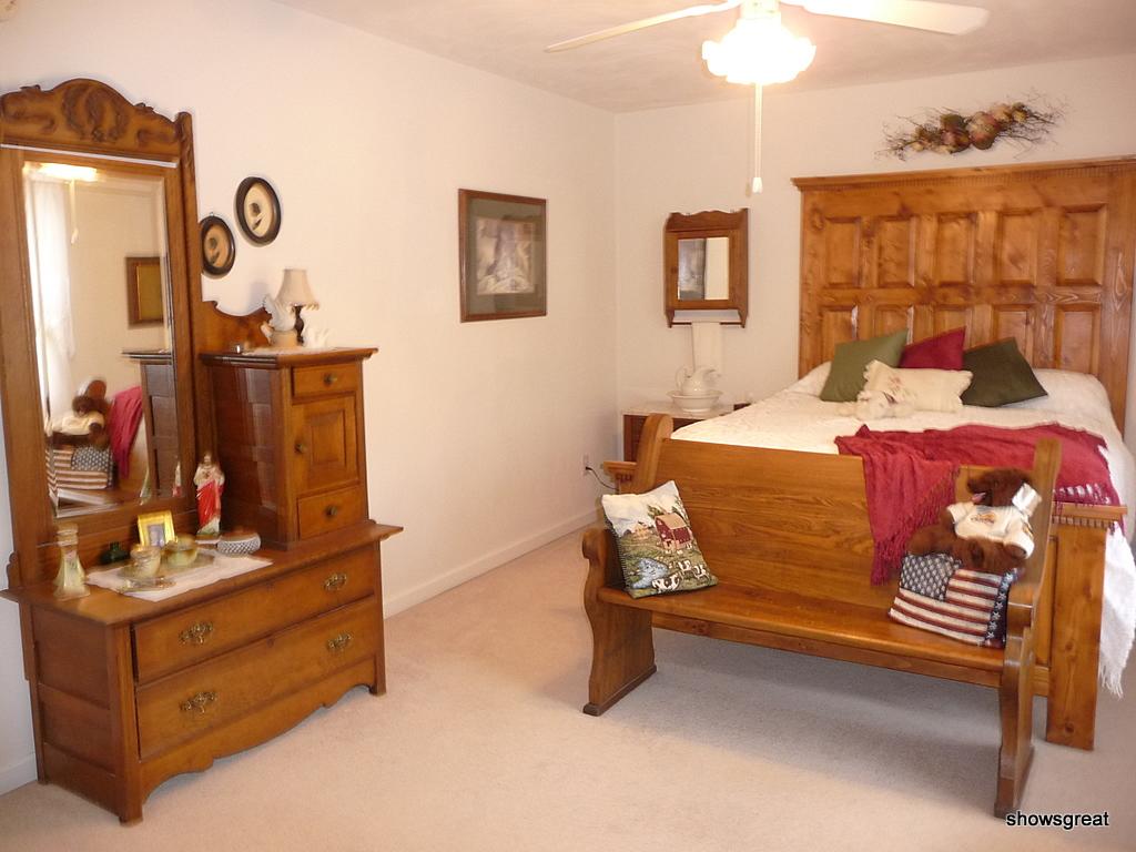 1770 Meadows Road Vinton, VA 24179 - Photo 8 of 37 a bed room with a bed and a mirror