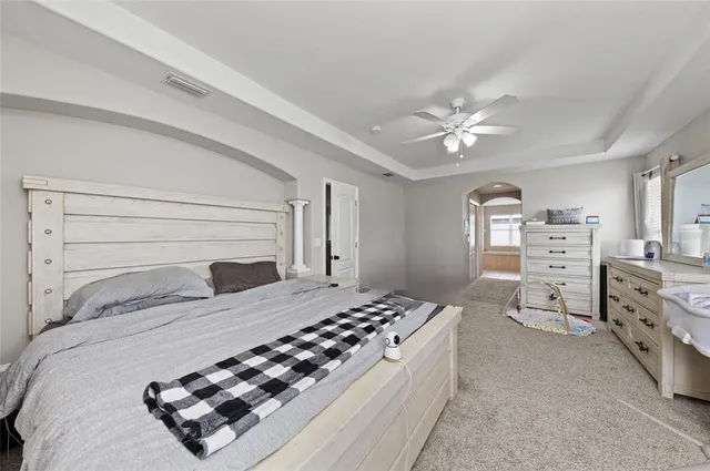 a bathroom with a tub a sink a mirror and a shower