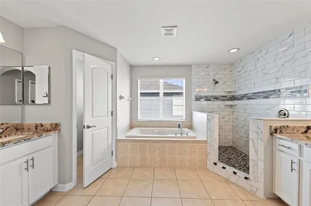 a bedroom with a bed and a desk