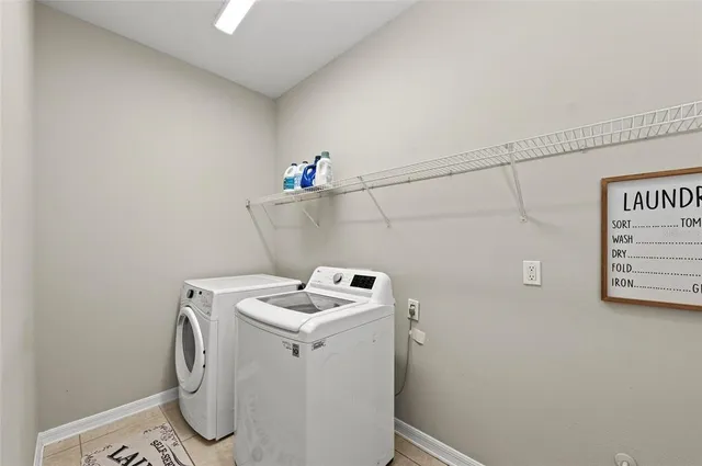 a view of a chair and table in backyard of the house