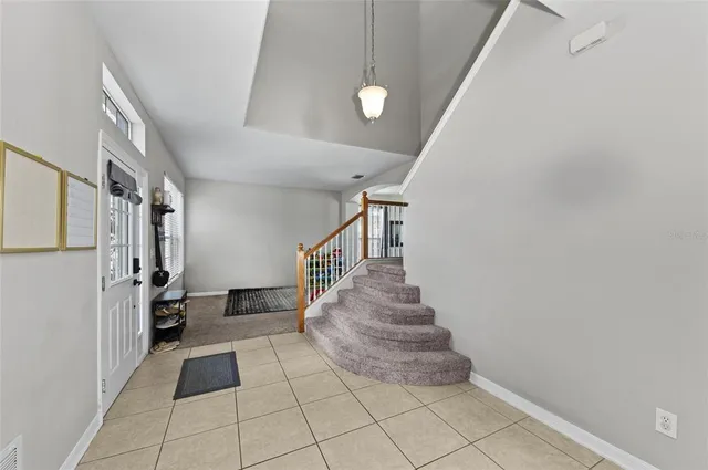 a kitchen with stainless steel appliances kitchen island granite countertop a refrigerator and microwave