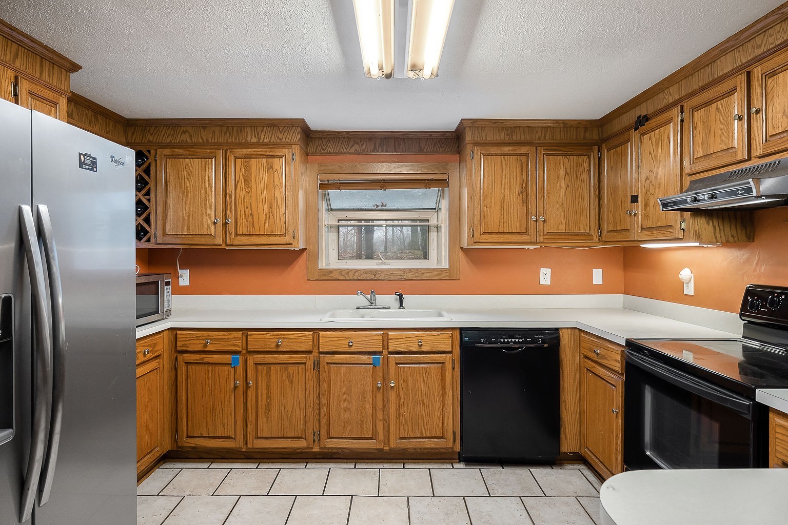 394 Dale Ridge Road Dowelltown, TN 37059 - Photo 12 of 32 a kitchen with stainless steel appliances granite countertop a sink stove and refrigerator