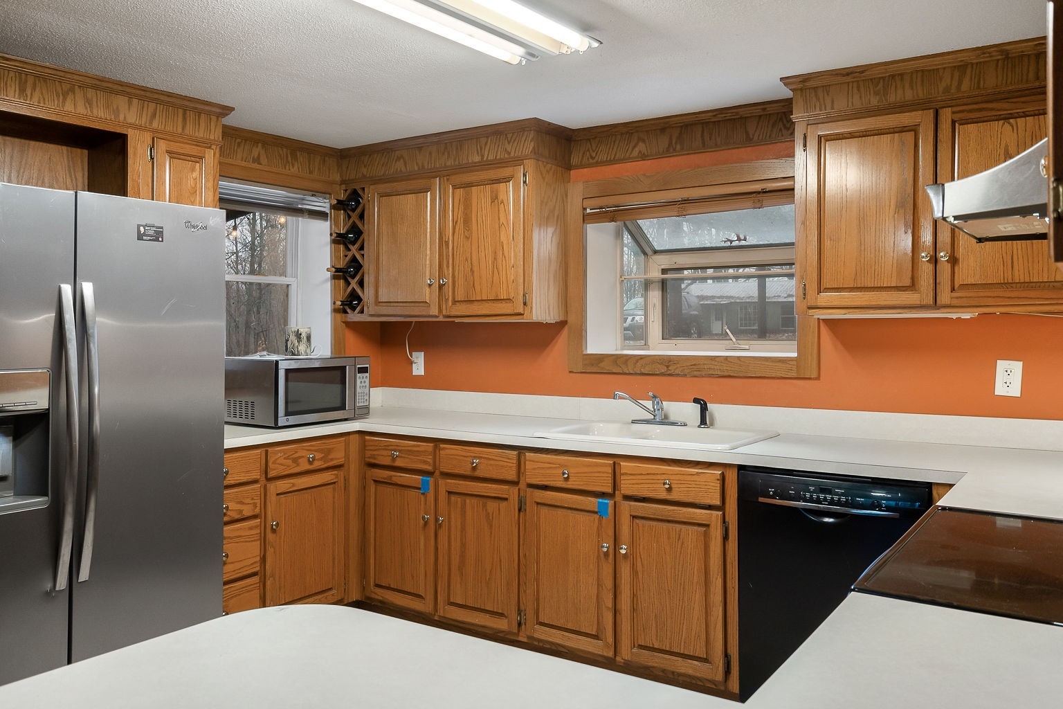 394 Dale Ridge Road Dowelltown, TN 37059 - Photo 13 of 32 a kitchen with stainless steel appliances granite countertop a refrigerator a sink and white cabinets