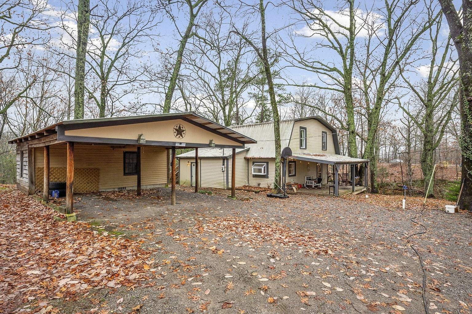394 Dale Ridge Road Dowelltown, TN 37059 - Photo 27 of 32 a house with trees in the background