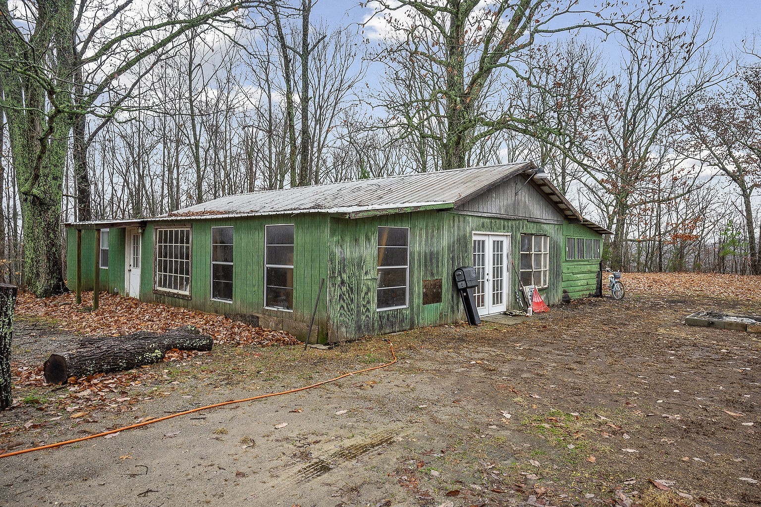 394 Dale Ridge Road Dowelltown, TN 37059 - Photo 31 of 32 a front view of a house with a garden and porch