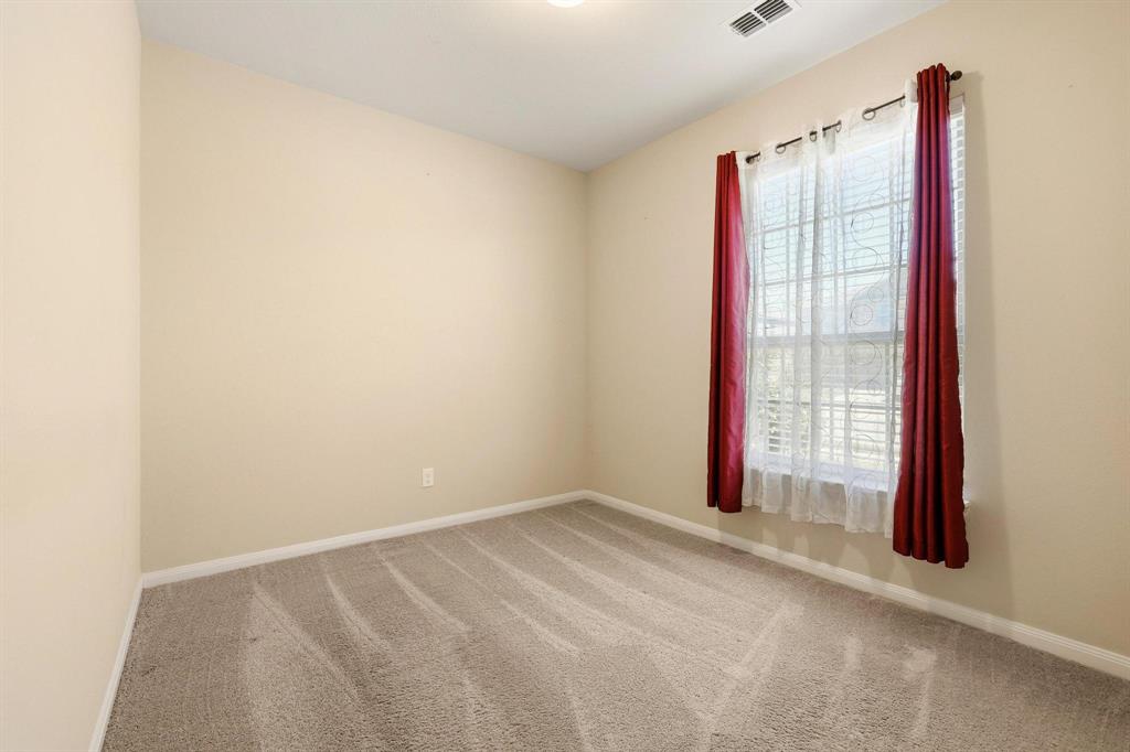 3005 Parker Road Anna, TX 75409 - Photo 13 of 33 Spare room with light colored carpet and baseboards