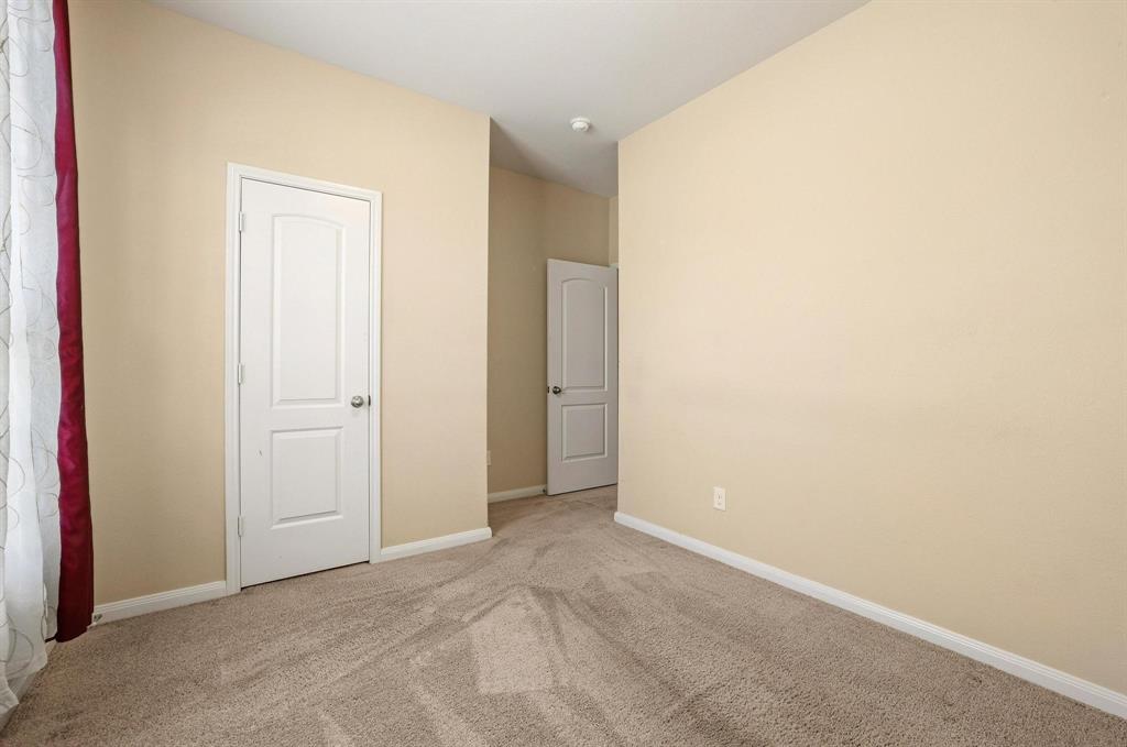 3005 Parker Road Anna, TX 75409 - Photo 15 of 33 Unfurnished bedroom with light colored carpet and baseboards