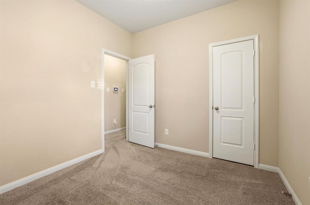 3005 Parker Road Anna, TX 75409 - Photo 20 of 33 Unfurnished bedroom featuring light carpet and baseboards