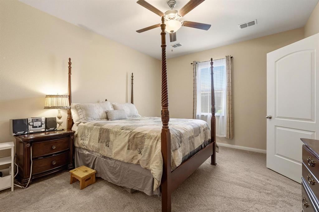3005 Parker Road Anna, TX 75409 - Photo 22 of 33 Bedroom featuring light colored carpet and ceiling fan