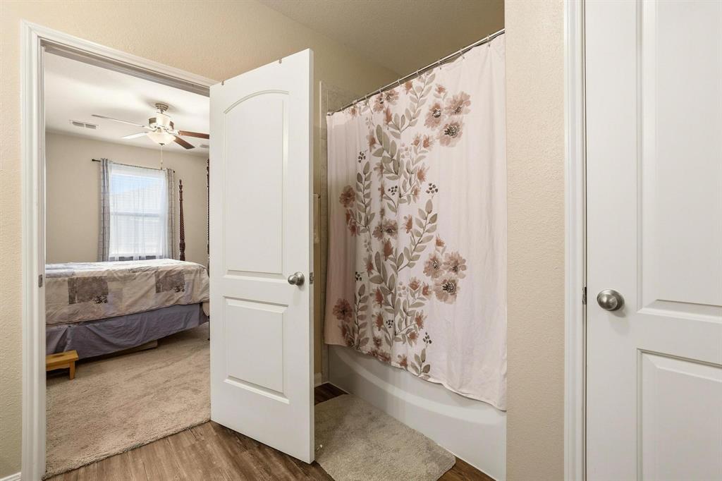 3005 Parker Road Anna, TX 75409 - Photo 26 of 33 Ensuite bathroom featuring light wood-style flooring and a ceiling fan
