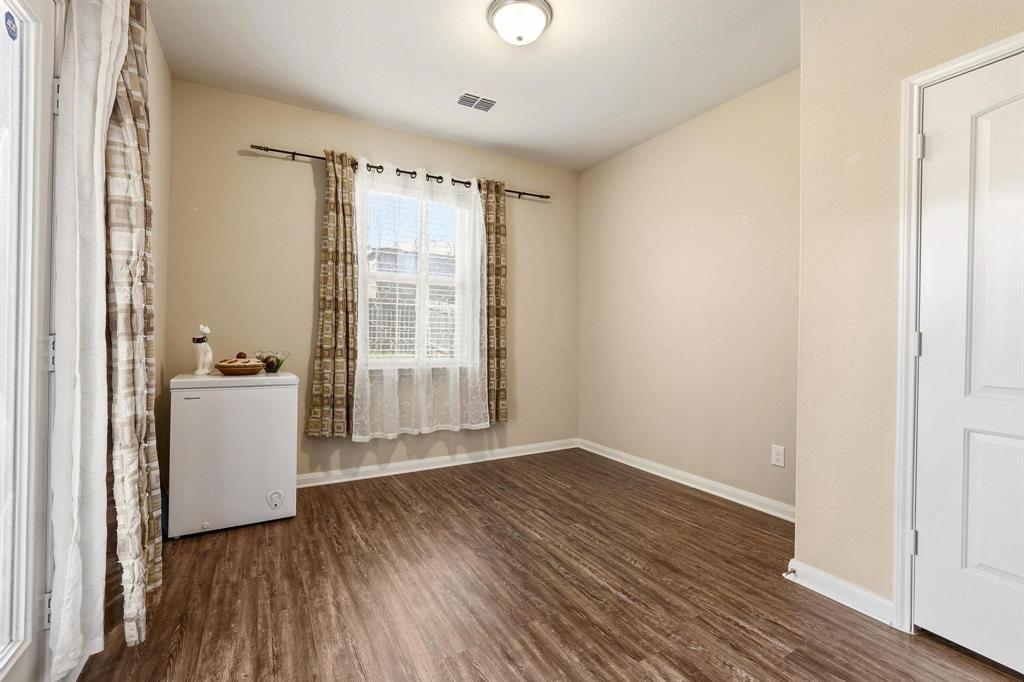 3005 Parker Road Anna, TX 75409 - Photo 7 of 33 Spare room featuring dark wood finished floors and baseboards