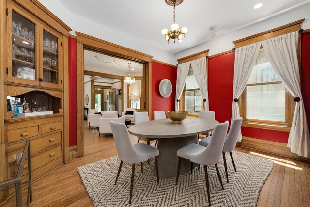 a view of a dining room with furniture window and wooden floor