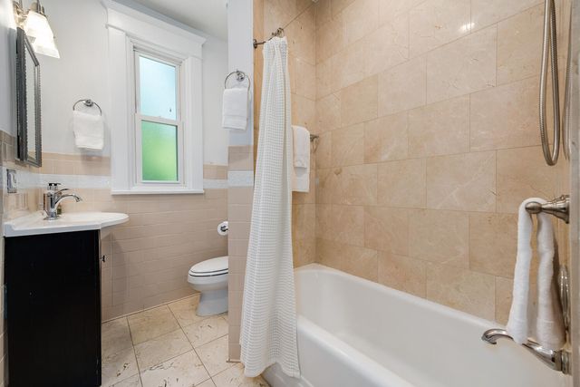 a bathroom with a sink a toilet and a bathtub